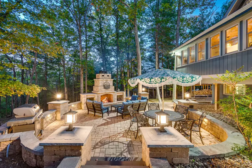 Back patio with outdoor fireplace and dining at a Shenandoah Valley vacation rental