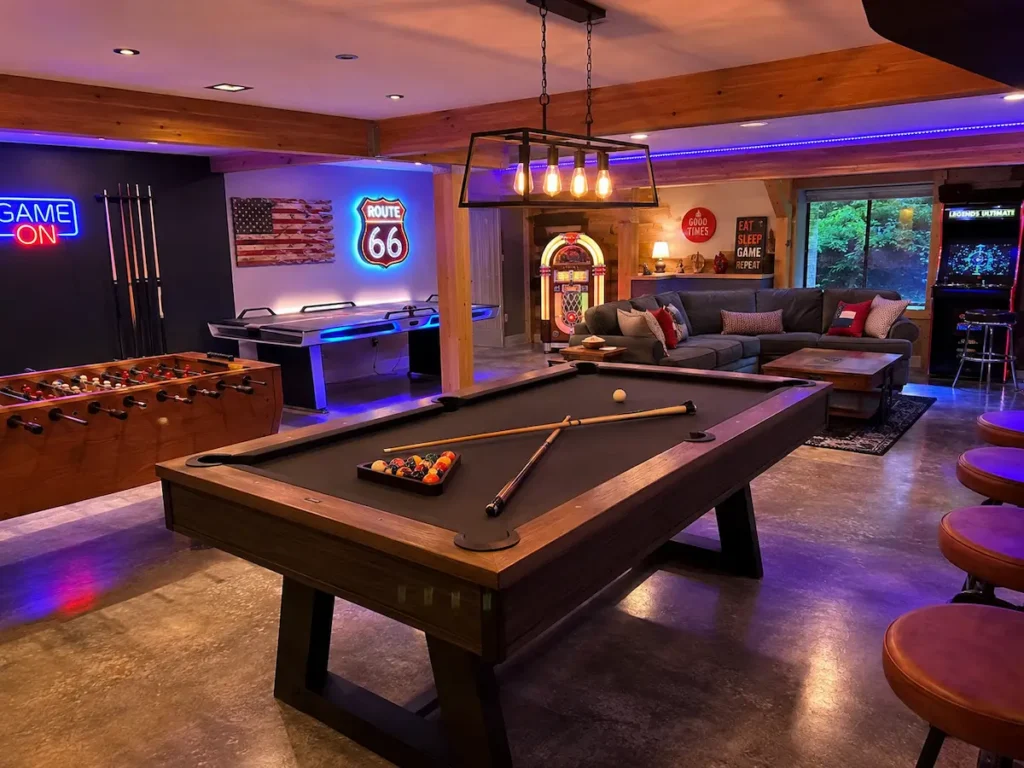 Game room with pool table and arcade games at a Shenandoah Valley vacation rental